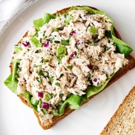 Tuna salad on lettuce and toast.