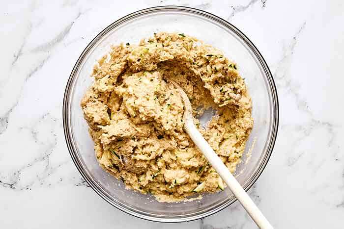 Making zucchini bread dough.
