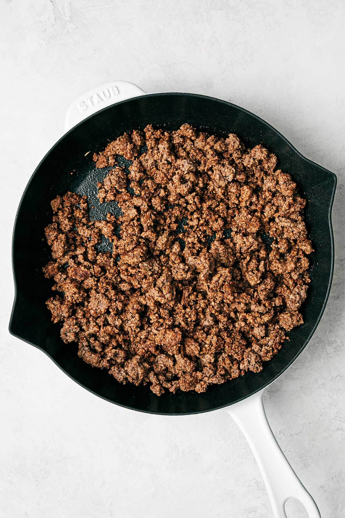 Cooked ground beef in a pan.