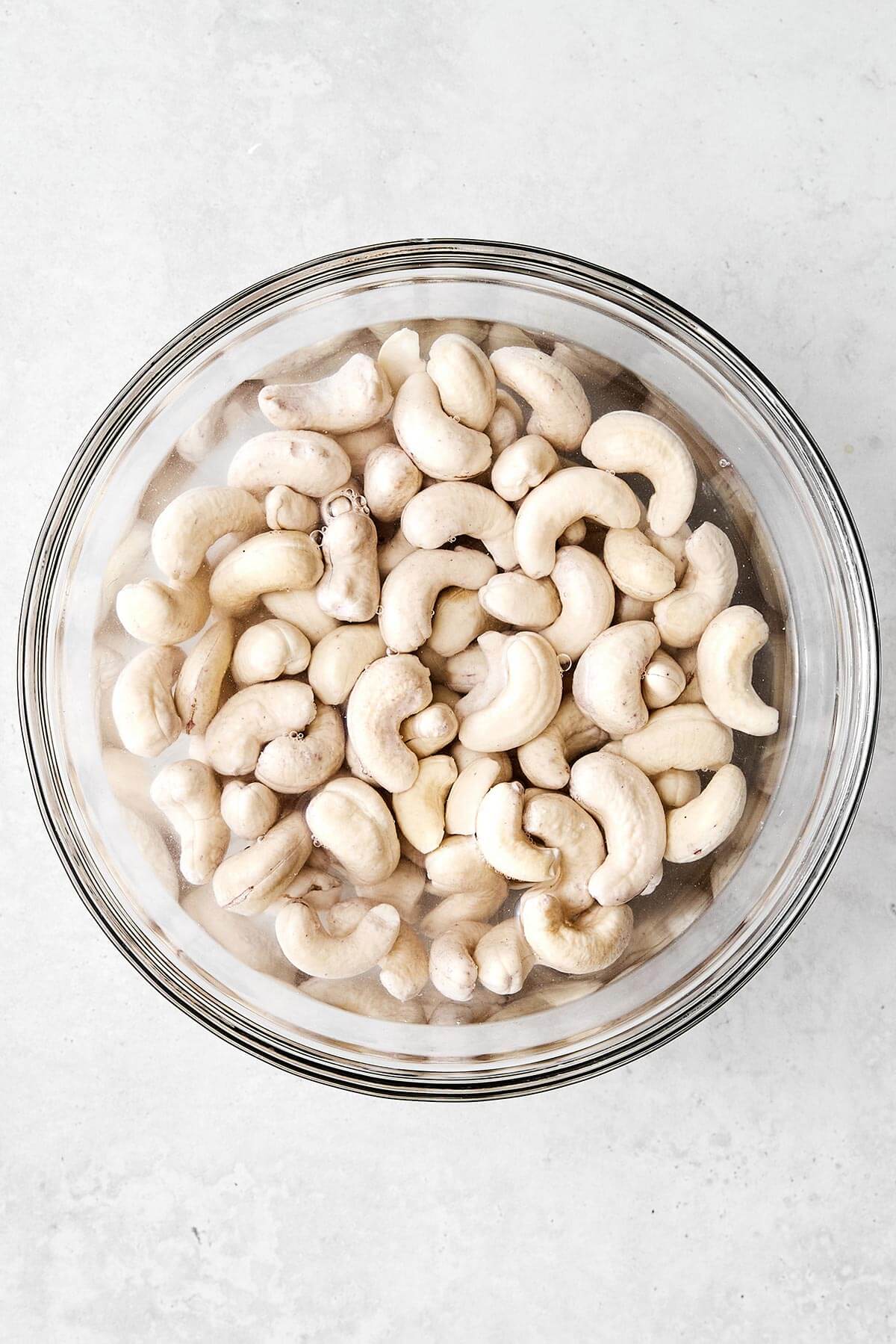 Cashews soaking in a bowl.