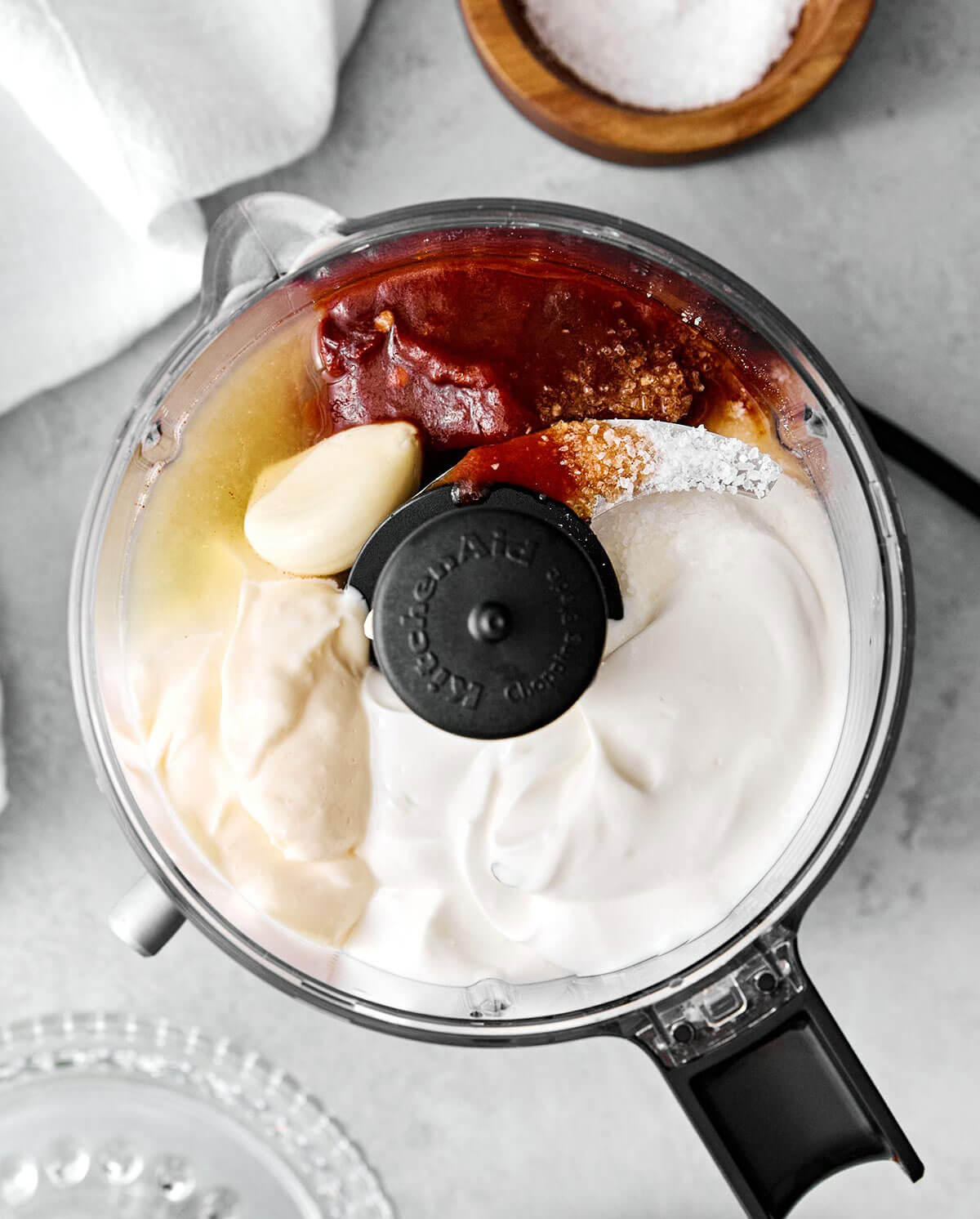 Blending chipotle sauce in a food processor.