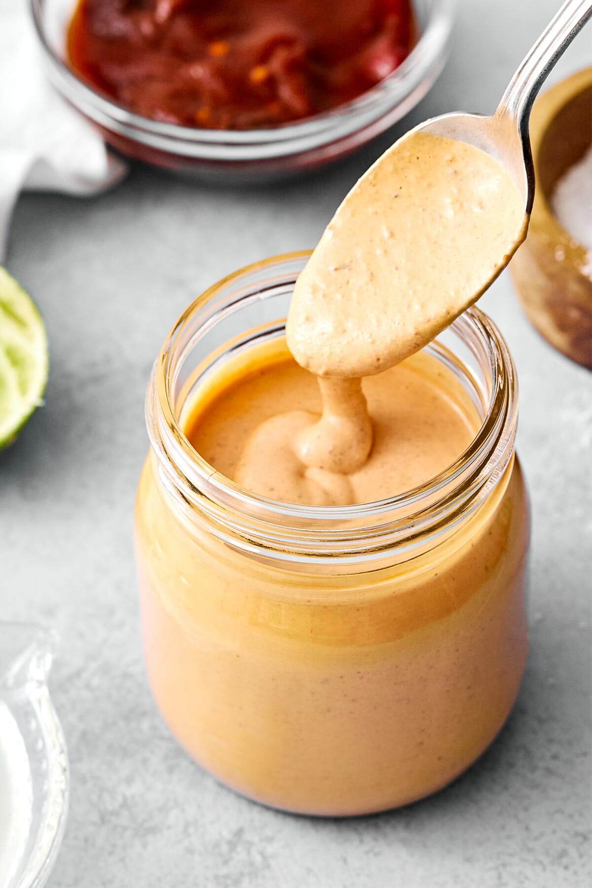 A jar of homemade chipotle sauce.