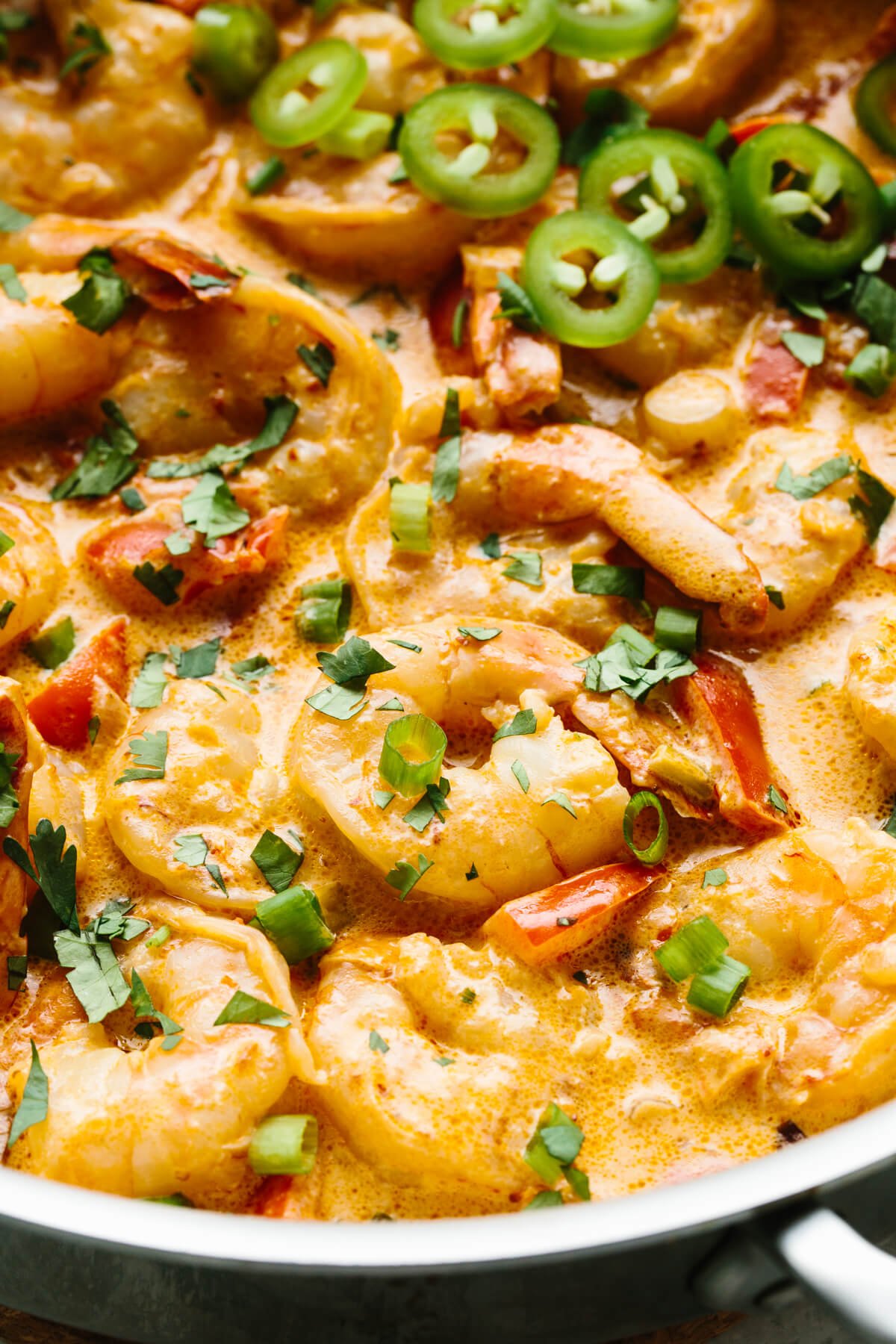 Close up photo of creamy chipotle shrimp in the pan.