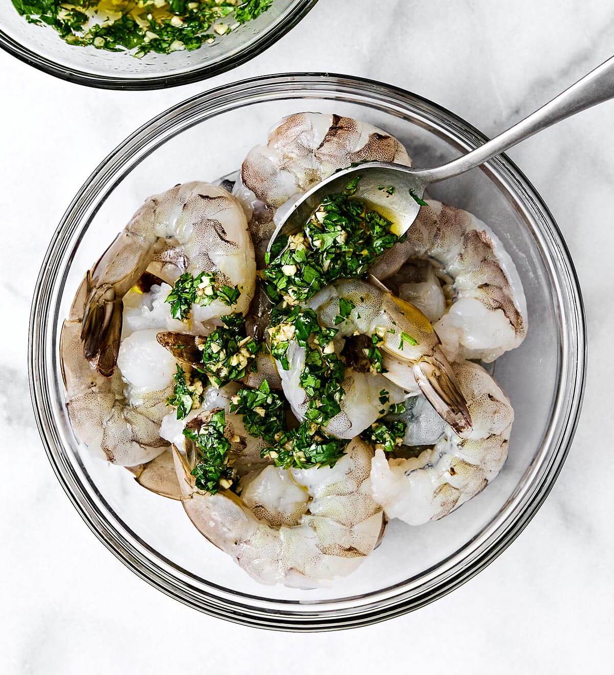 This grilled shrimp is a quintessential summertime grilling recipe! It's made with the best shrimp marinade and is perfect for your next BBQ. Marinating shrimp before grilling.