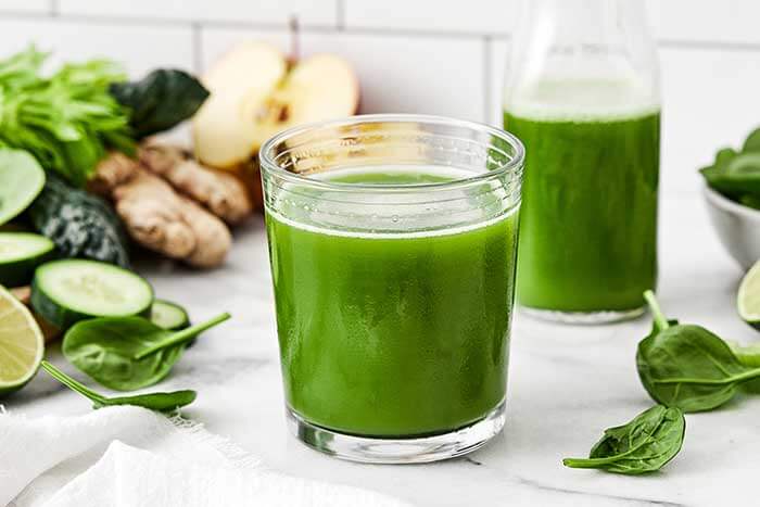 Green juice in a glass cup.