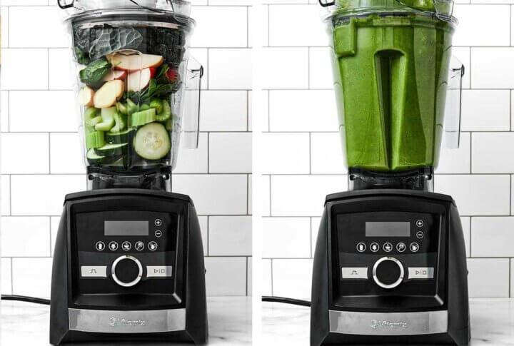 Blending green juice in a Vitamix blender.