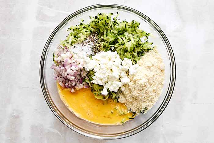 Mixed zucchini ingredients in a bowl.