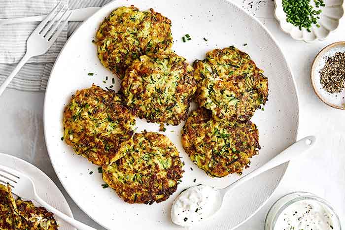 Zucchini fritters on a plate.