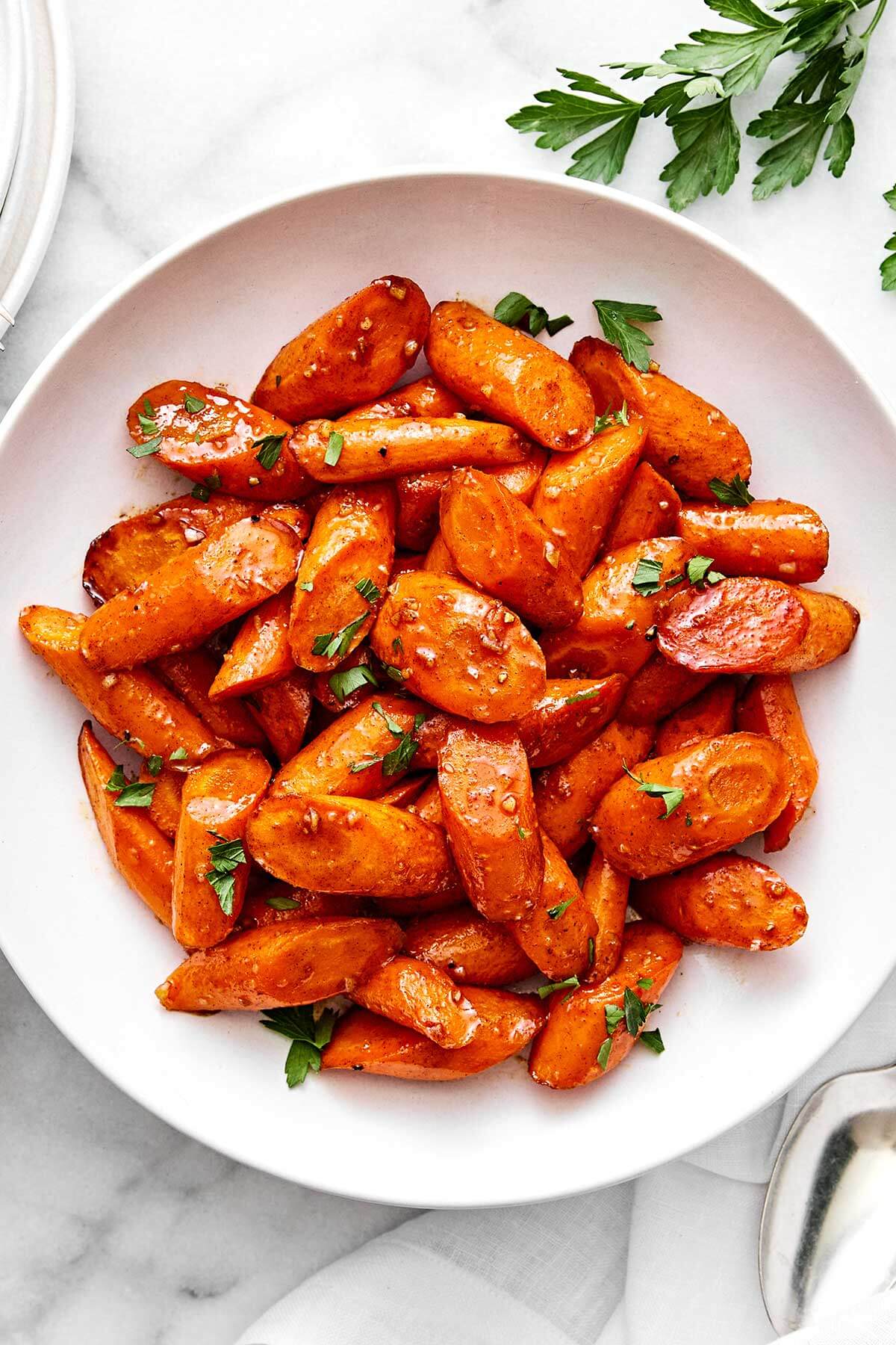 A bowl of honey glazed carrots.