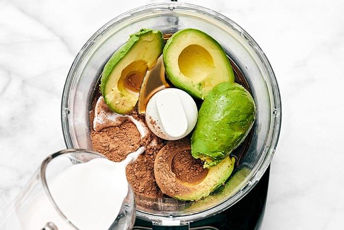 Chocolate avocado pudding in food processor.