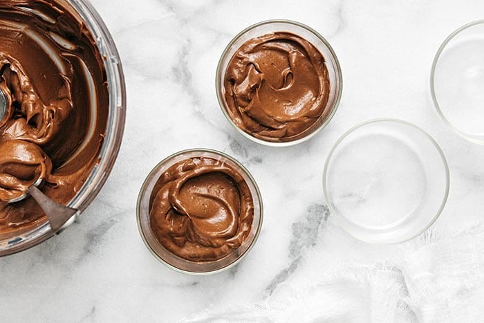 Cups of chocolate avocado pudding.
