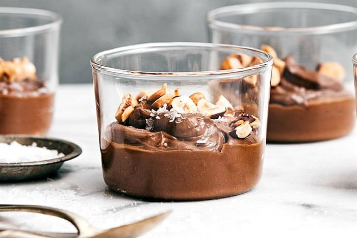 A cup of chocolate avocado pudding.