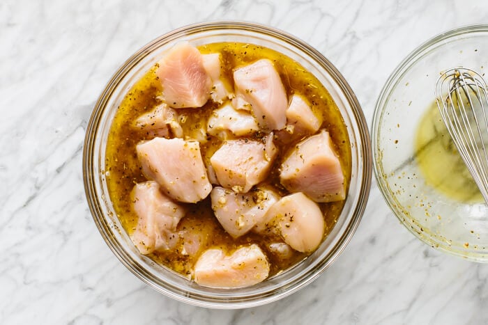 A bowl of marinated chicken