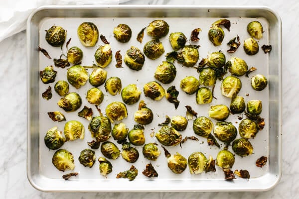 Roasted Brussels sprouts on a sheet pan.