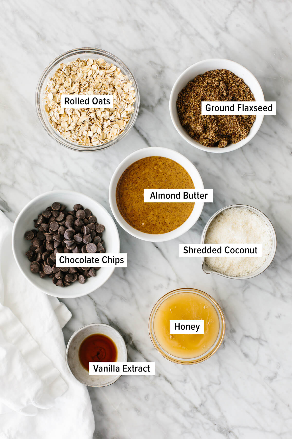 Ingredients for no bake chocolate chip energy balls on a table.