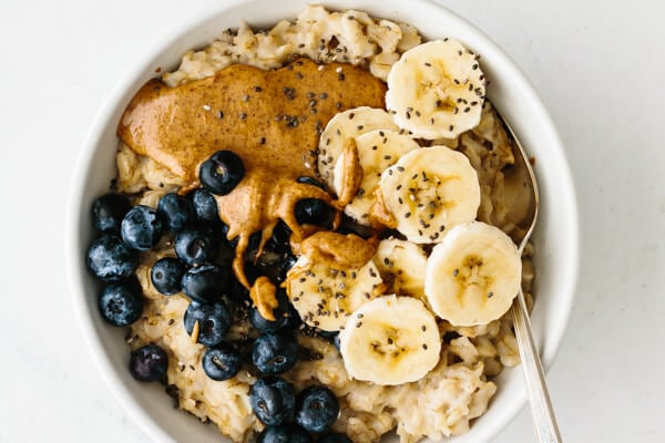 Oatmeal recipe with blueberries, bananas, and almond butter.