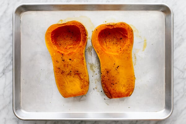 Roasted butternut squash halves for orange shakshuka.