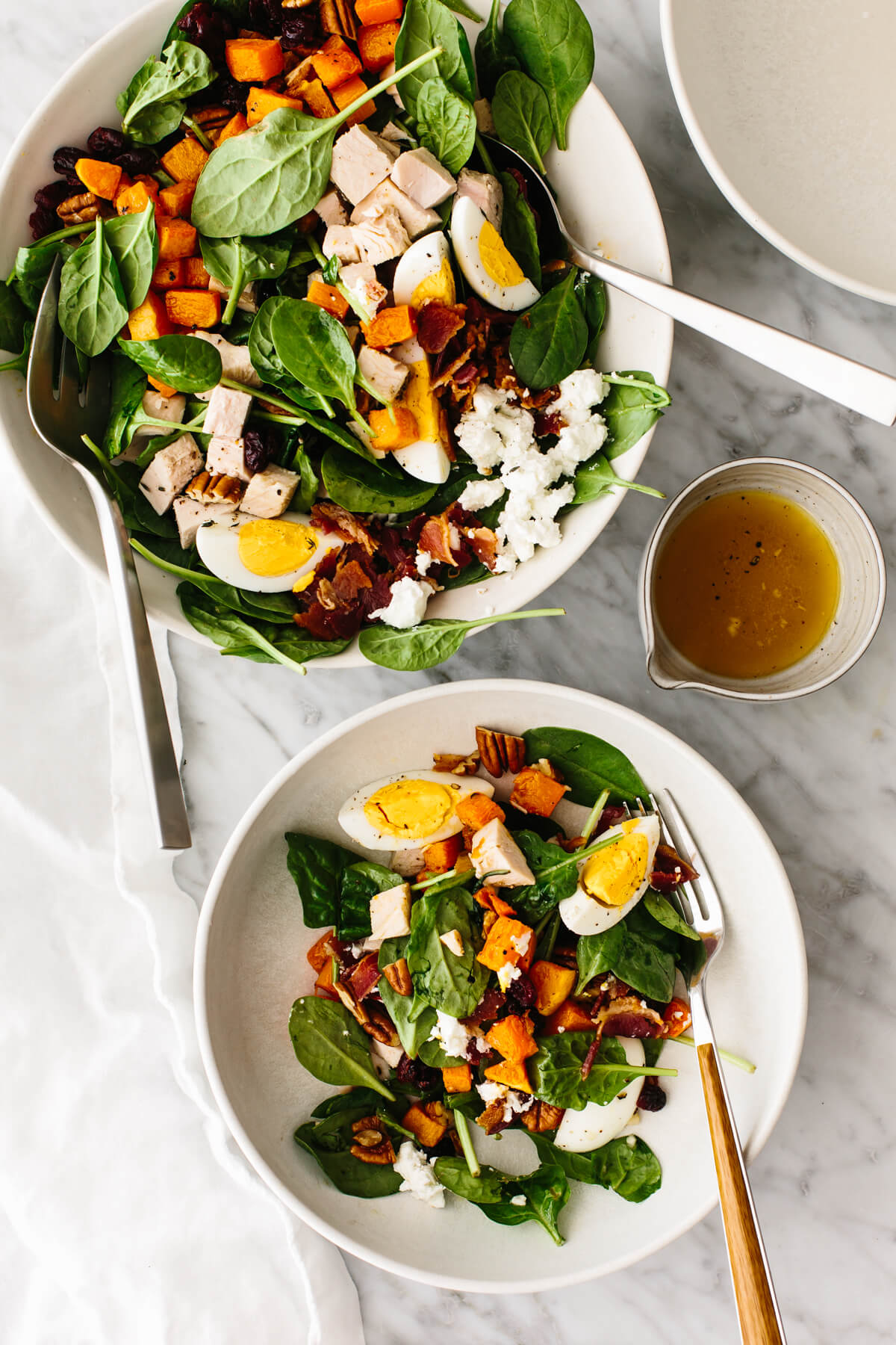 Turkey cobb salad in two bowls on a table.