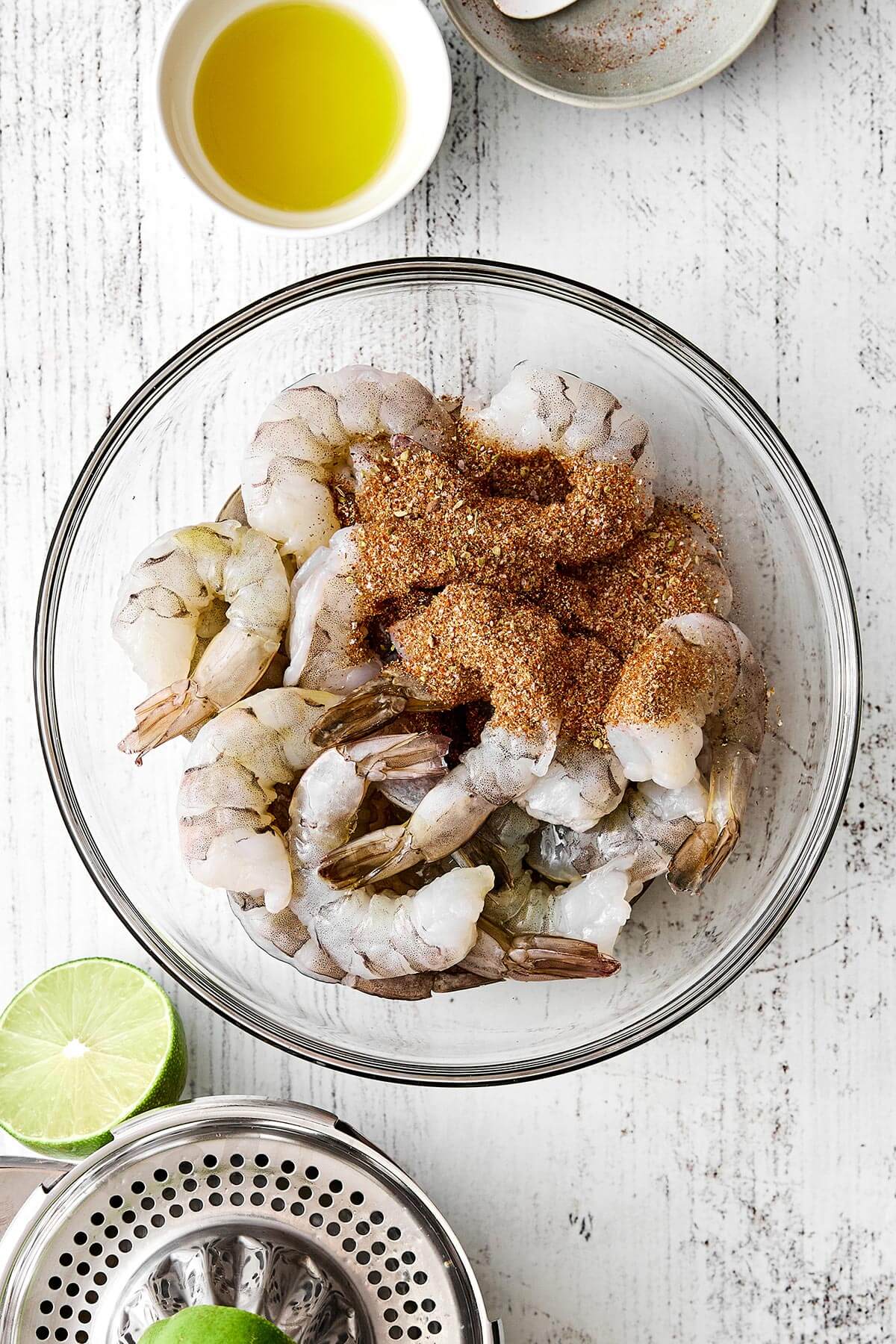 Tossing shrimp in fajita seasoning.