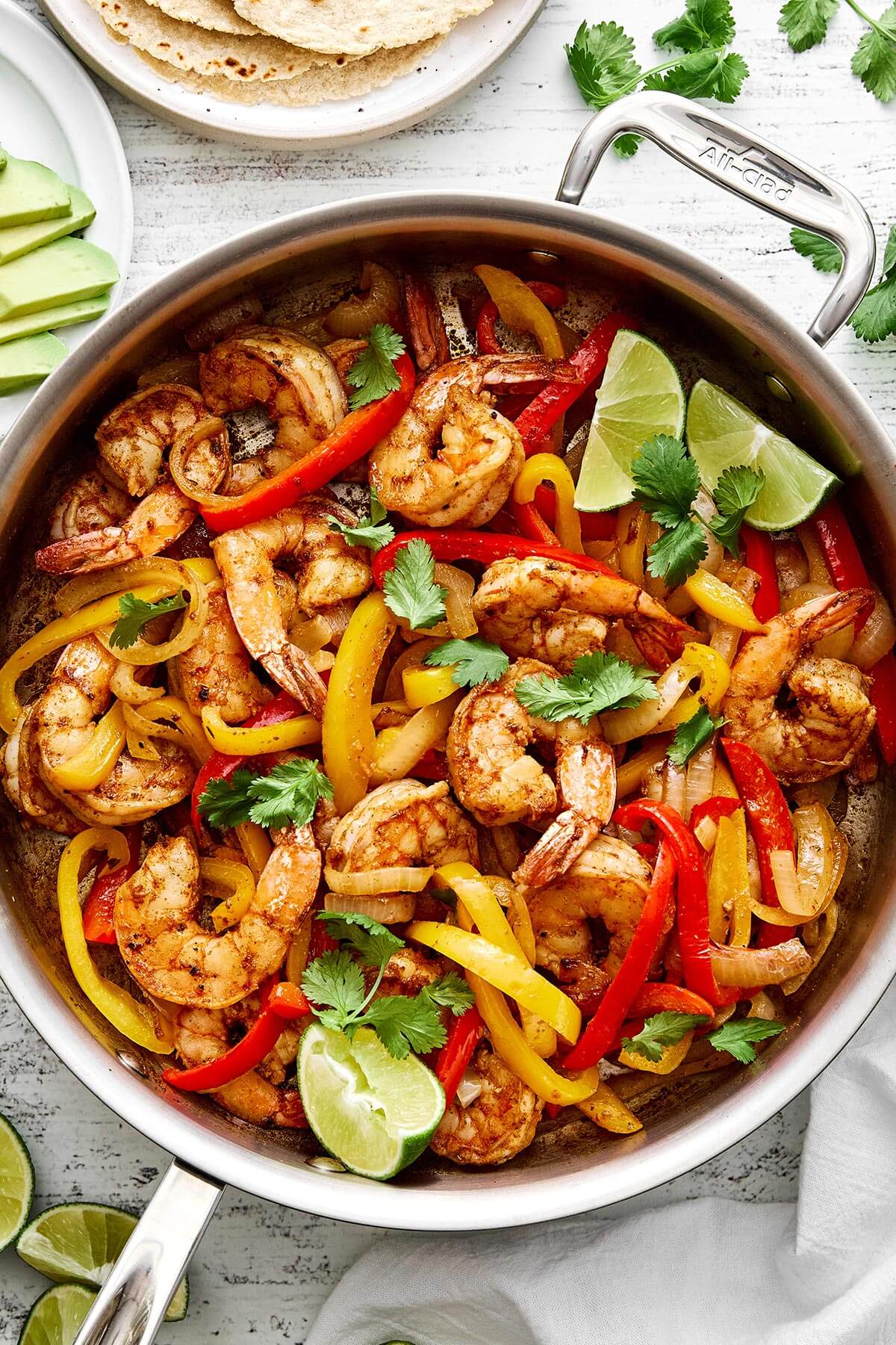 Shrimp fajitas in a skillet.