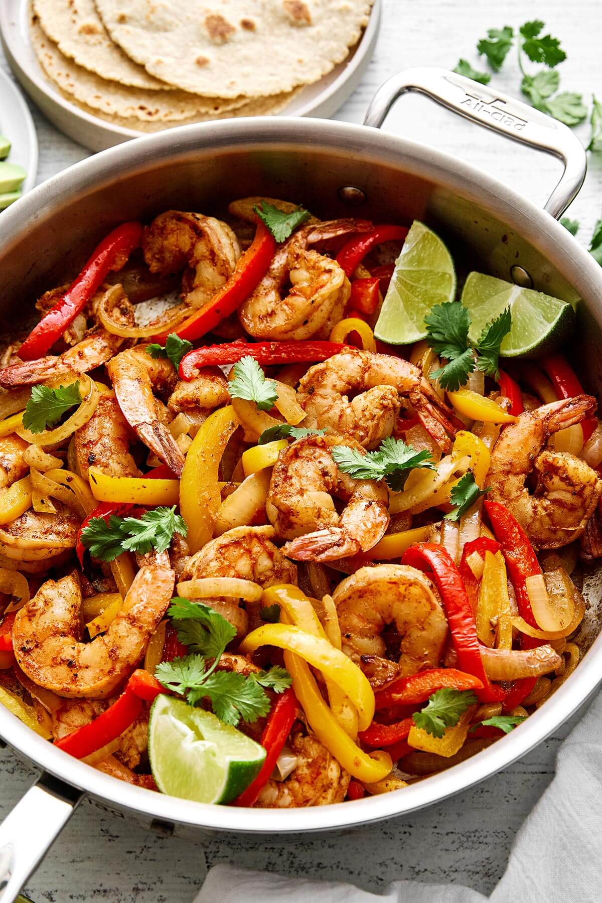 A pan of shrimp fajitas.