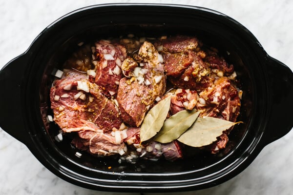 Cooking beef barbacoa in a slow cooker.