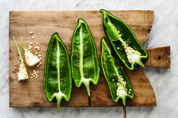 Desseeding poblano peppers for carnitas stuffed peppers.
