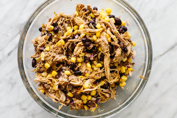 Mixing the filling for carnitas stuffed poblano peppers.