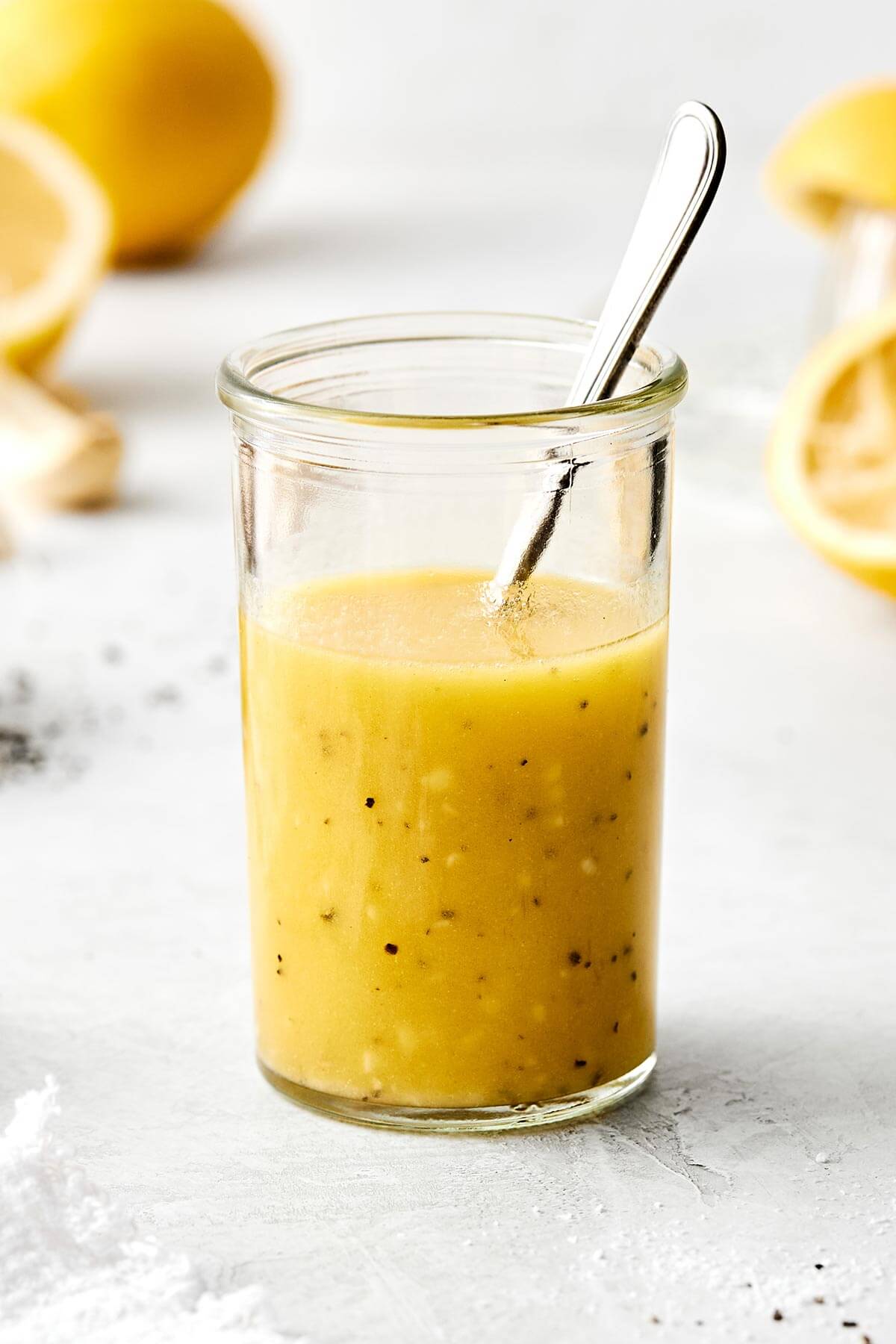 This lemon vinaigrette is a staple dressing that instantly brightens any salad or veggies, and tastes much better than store-bought versions! A jar of lemon vinaigrette.