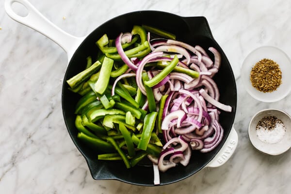 Sauteeing fajita veggies in a pan.