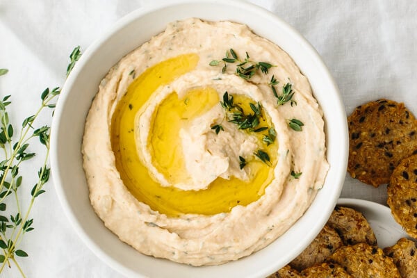 A bowl of white bean dip.