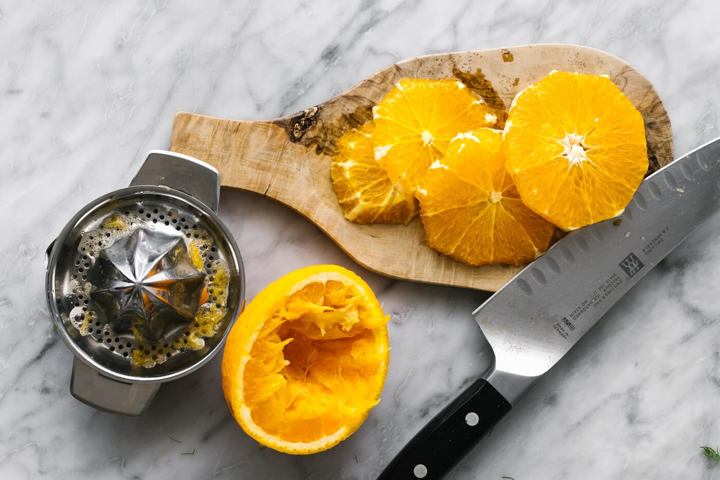 Sliced fresh oranges on a wooden board.