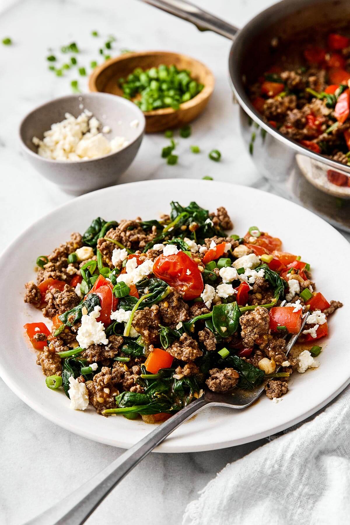 This Mediterranean ground beef stir-fry will be your new go-to dinner. It's easy, healthy, packed with protein, and delicious! A plate of Mediterranean ground beef stir fry.
