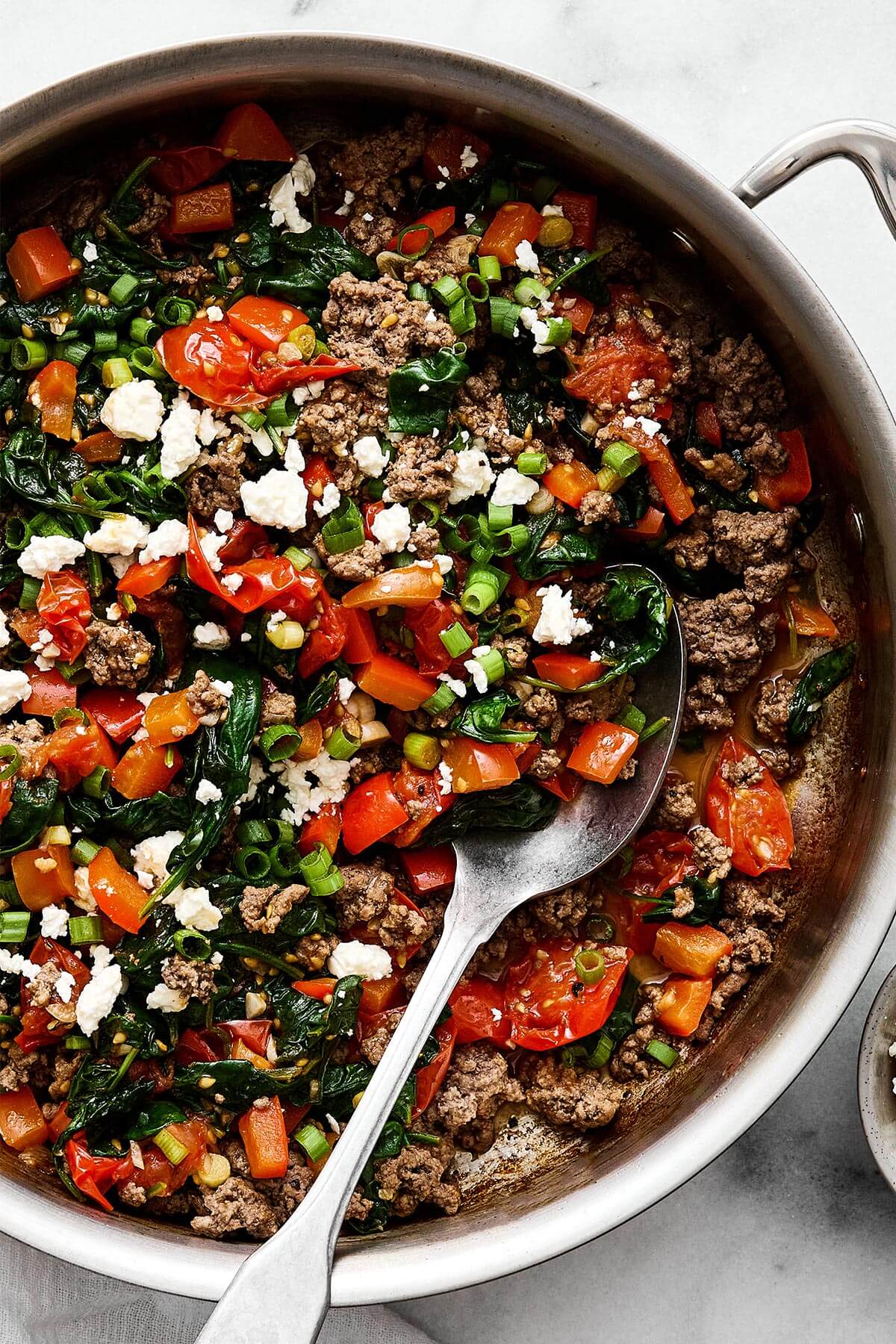 This Mediterranean ground beef stir-fry will be your new go-to dinner. It's easy, healthy, packed with protein, and delicious! A pan of Mediterranean ground beef stir fry.