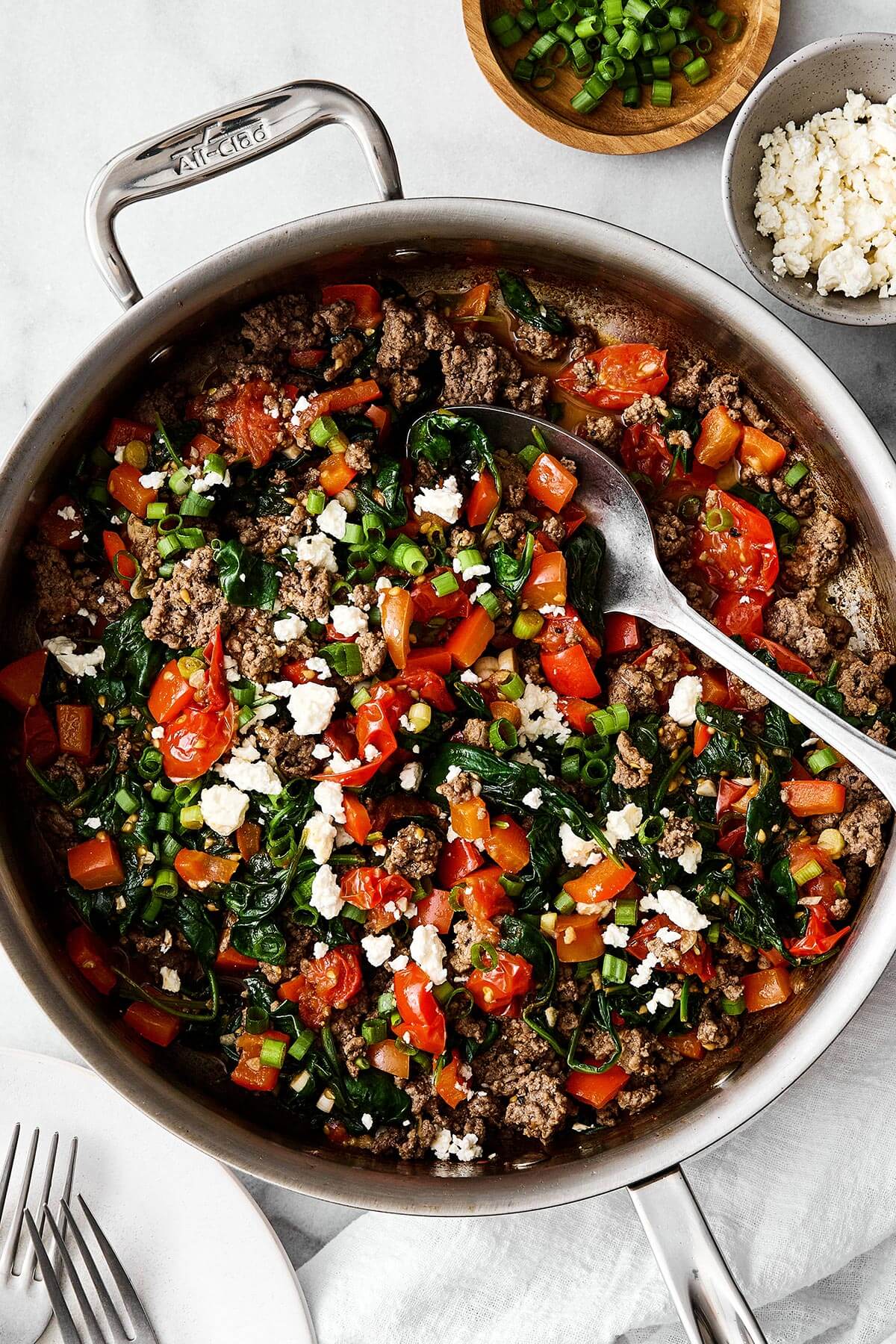 This Mediterranean ground beef stir-fry will be your new go-to dinner. It's easy, healthy, packed with protein, and delicious! Mediterranean ground beef stir fry in a pan.