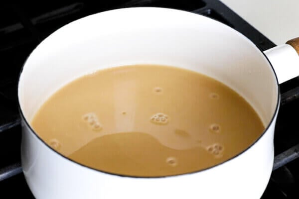 Mixing a pumpkin spice latte in a sauce pan