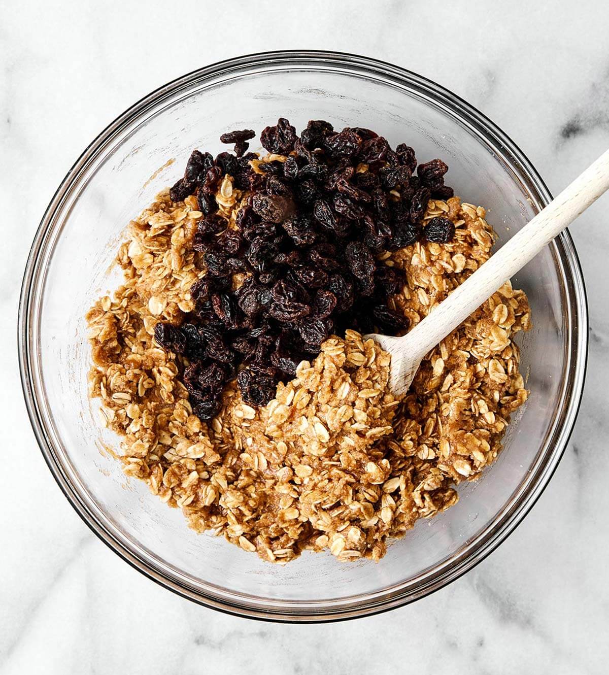 These are everything you want in a healthy oatmeal cookie! They're soft and chewy, perfectly spiced, and dotted with raisins. Mixing oatmeal cookie dough.