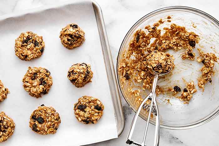 Scooping cookie dough.