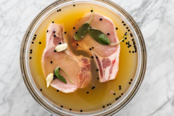 Soaking pork chops in apple cider brine.