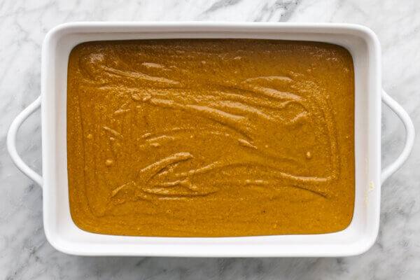 Gluten-free pumpkin pie batter in a baking dish