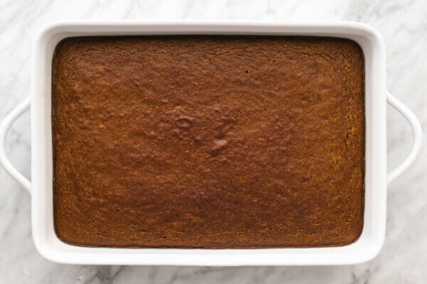Gluten-free pumpkin pie cake in a white baking dish.
