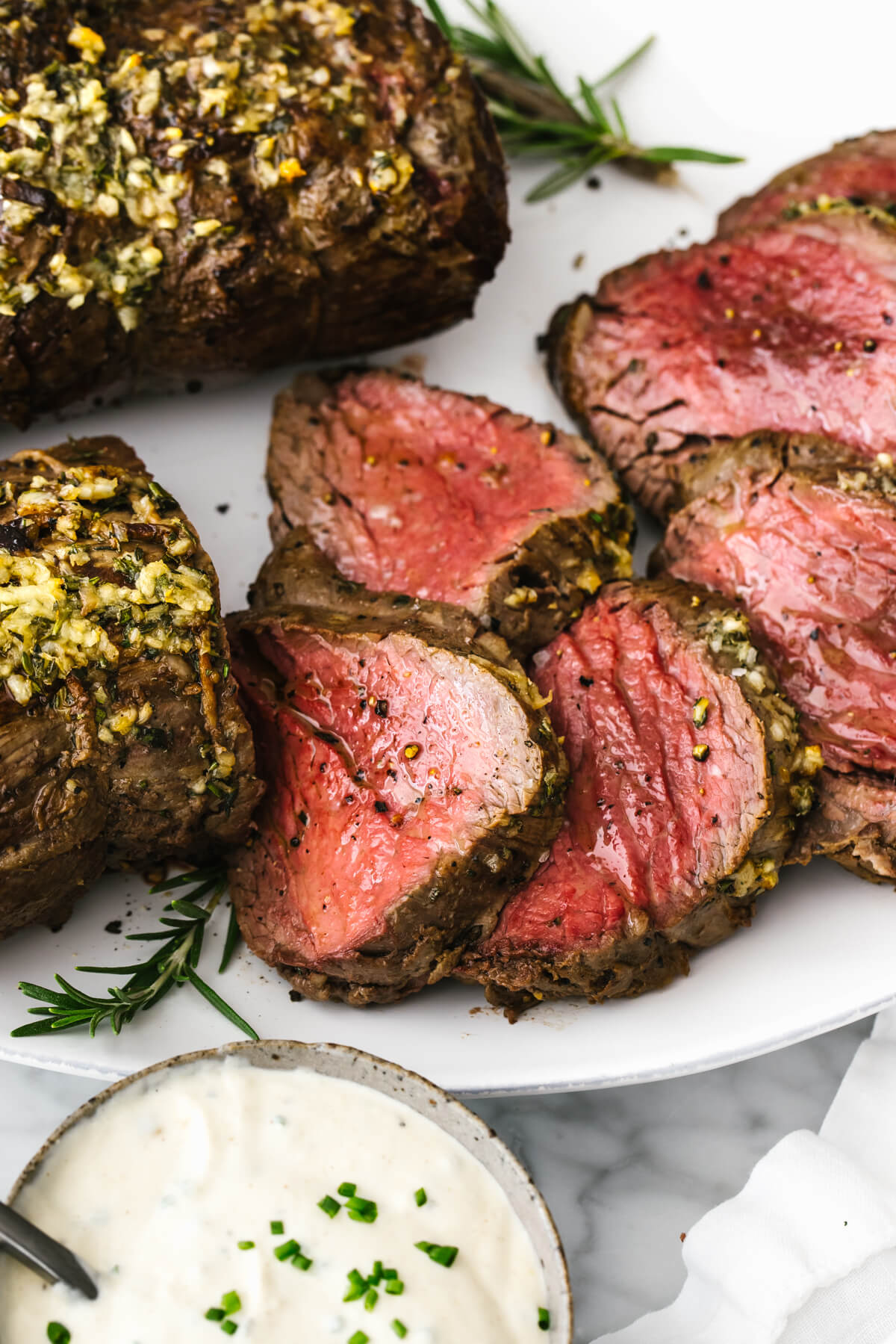 Slices of beef tenderloin roast on a plate