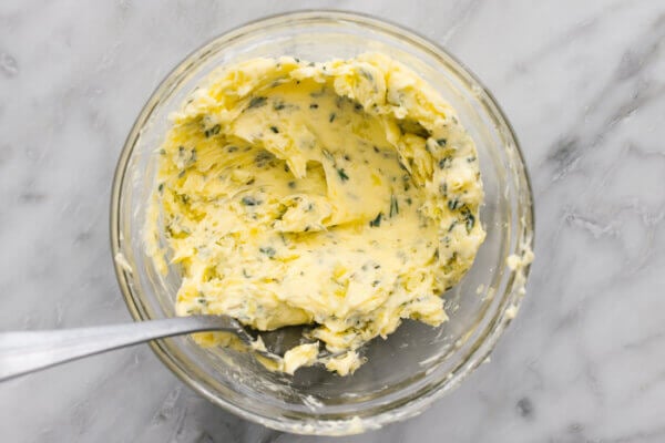 A bowl of herb butter for beef tenderloin