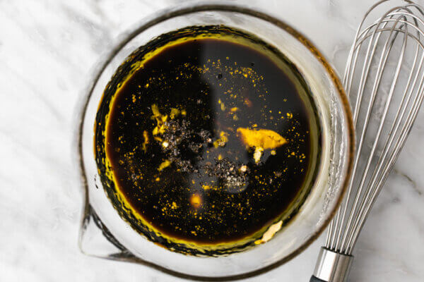 Balsamic vinaigrette ingredients in a measuring cup