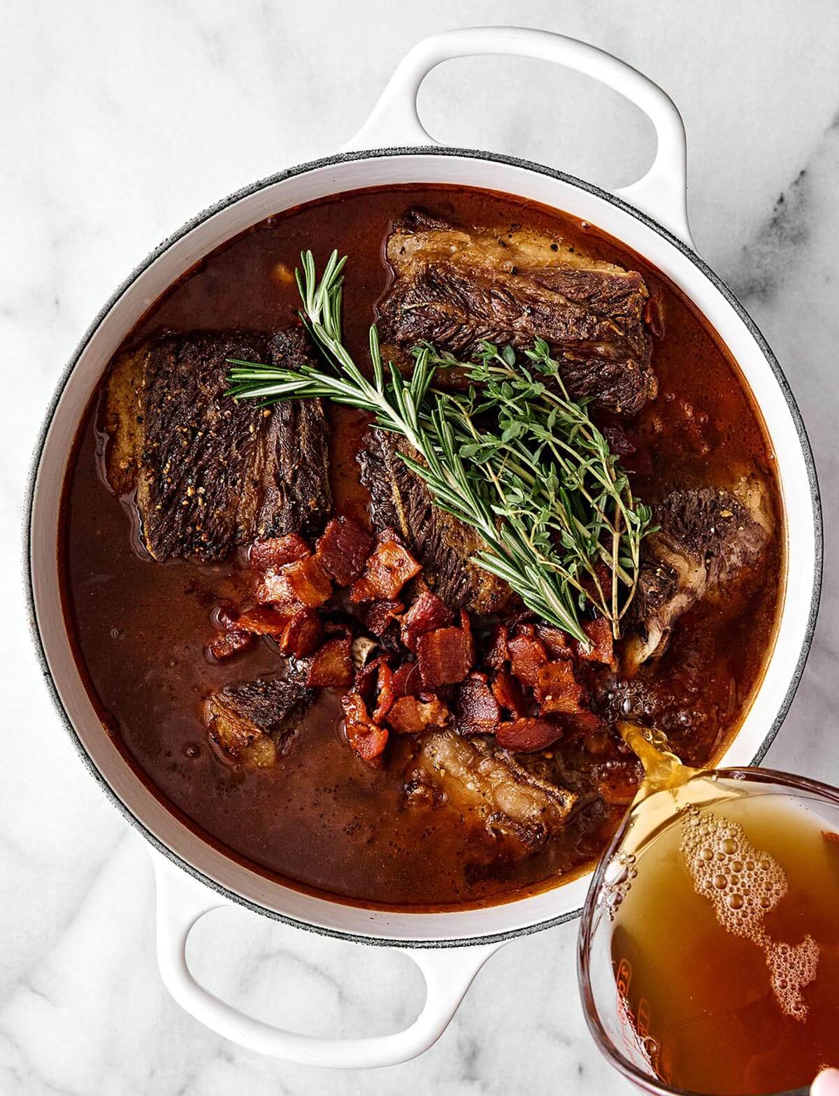 Making braised short ribs in a pot.