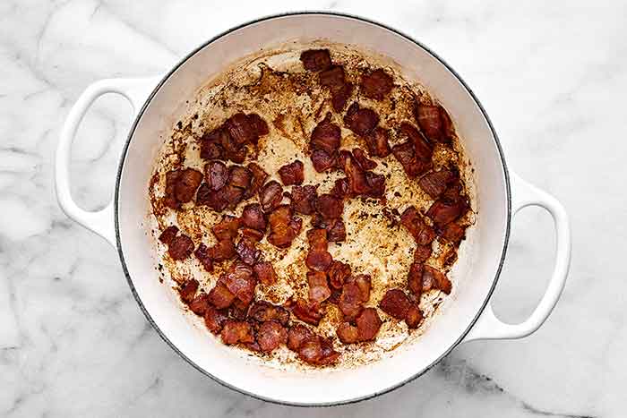Cooking bacon in a pot.
