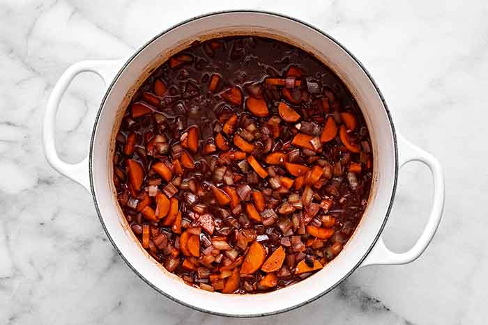 Simmering vegetables in a pot.