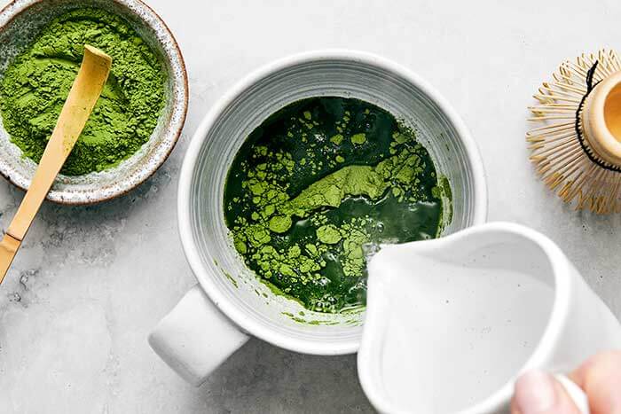 Making matcha latte.