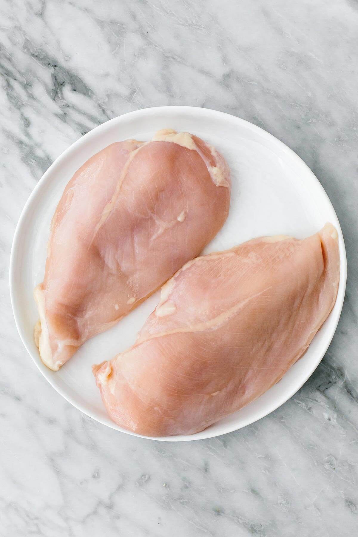 These chicken marinades are one of the best (and easiest) ways to give your favorite protein some big flavor and maximum juiciness! Chicken breasts on a plate.