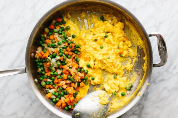 Scrambled eggs and veggies in a pan for shrimp fried rice